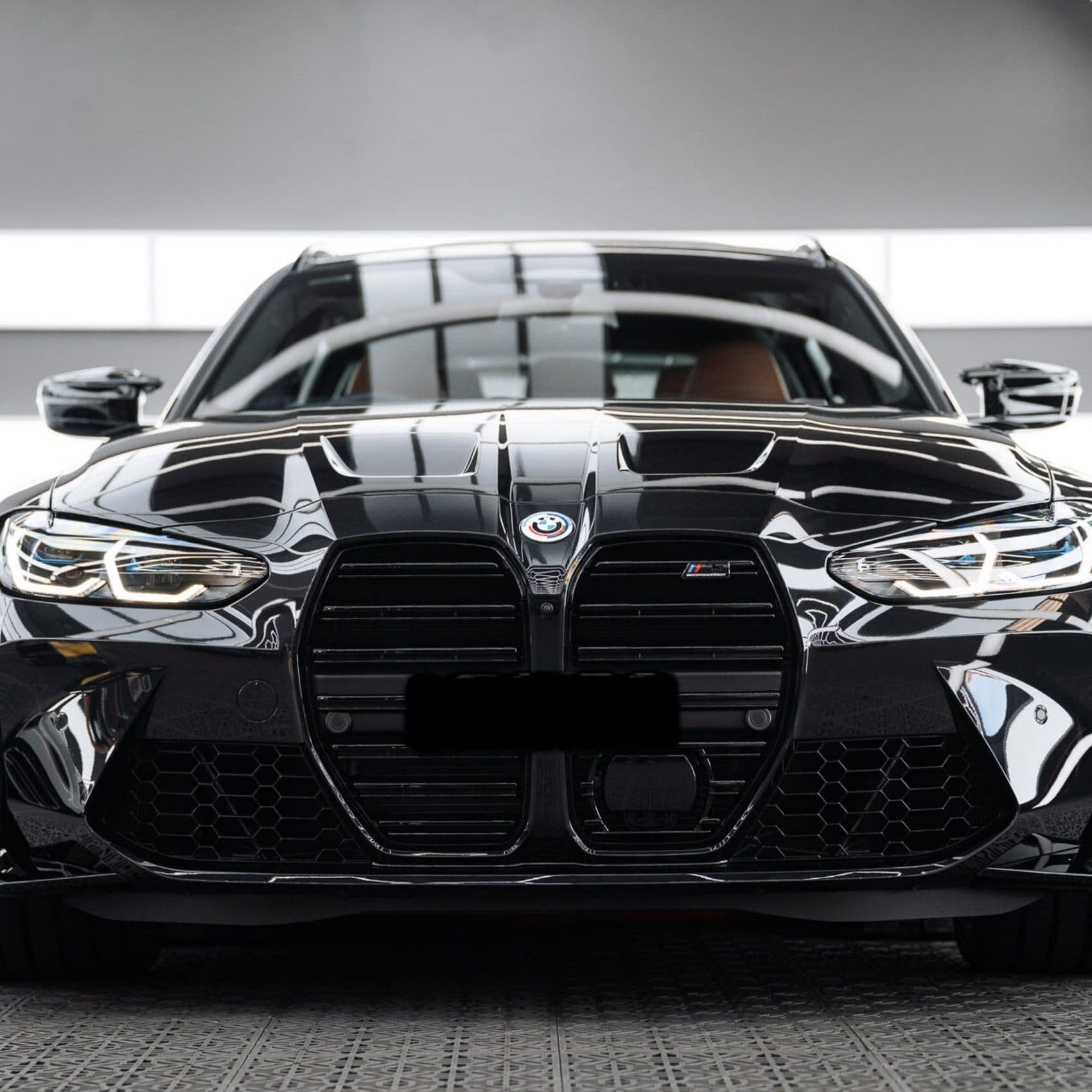Black BMW with a deep gloss finish after a full detail
